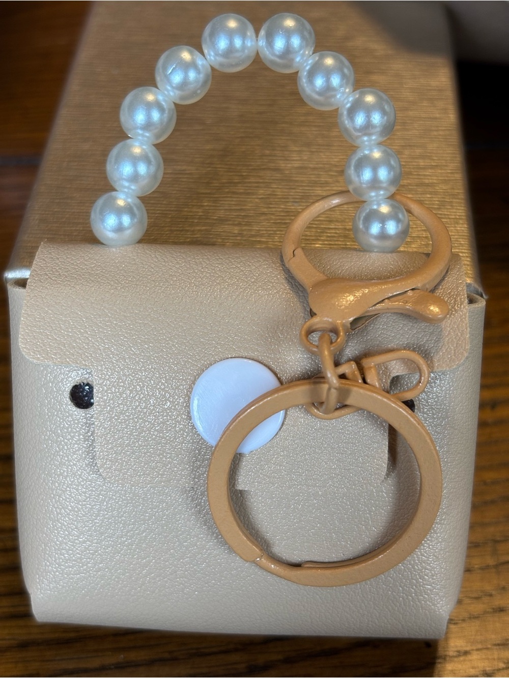 Mini‎ purse key chain charms for bag with faux pearls for handle. Snaps  tan